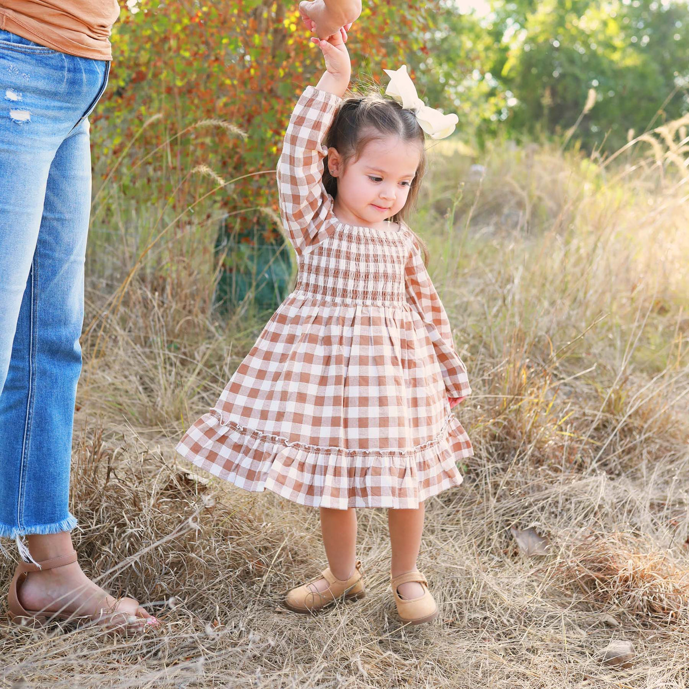 camel gingham dress for kids with long sleeves and smocked top