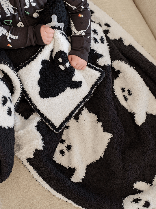 boy with cuddlelane ghost blanket and lovey