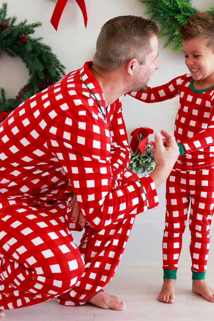 Father and son in red, green, and white plaid Caden Lane pajamas