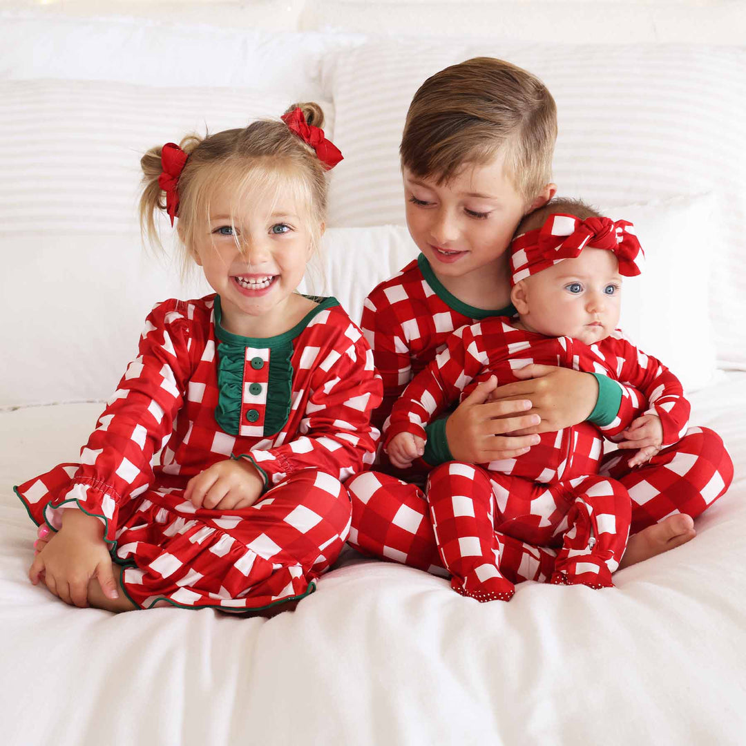 red and white check christmas pajamas for siblings 