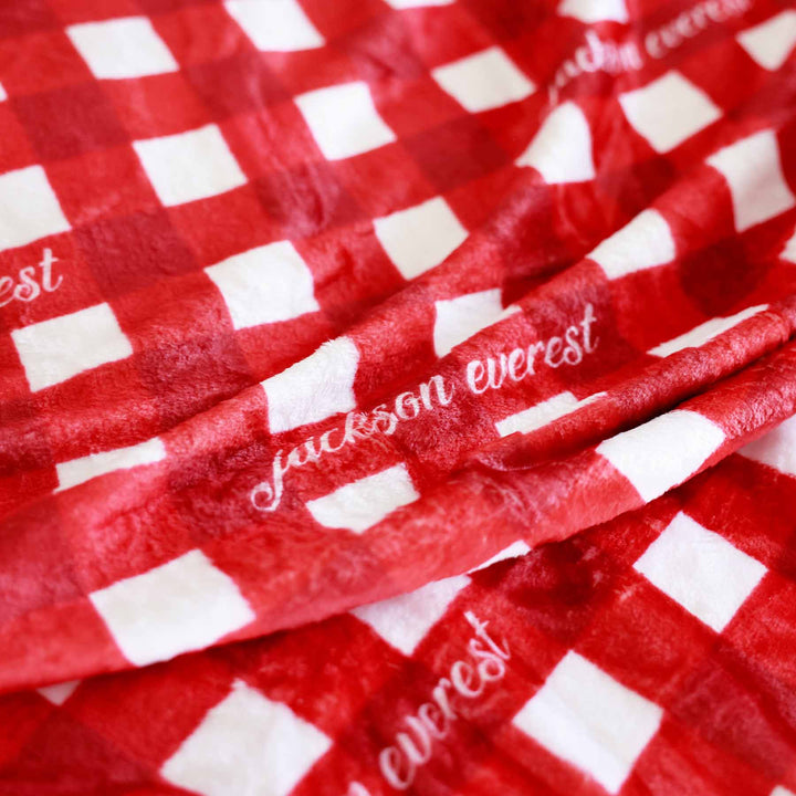 red and white check personalized blanket for kids with white font 