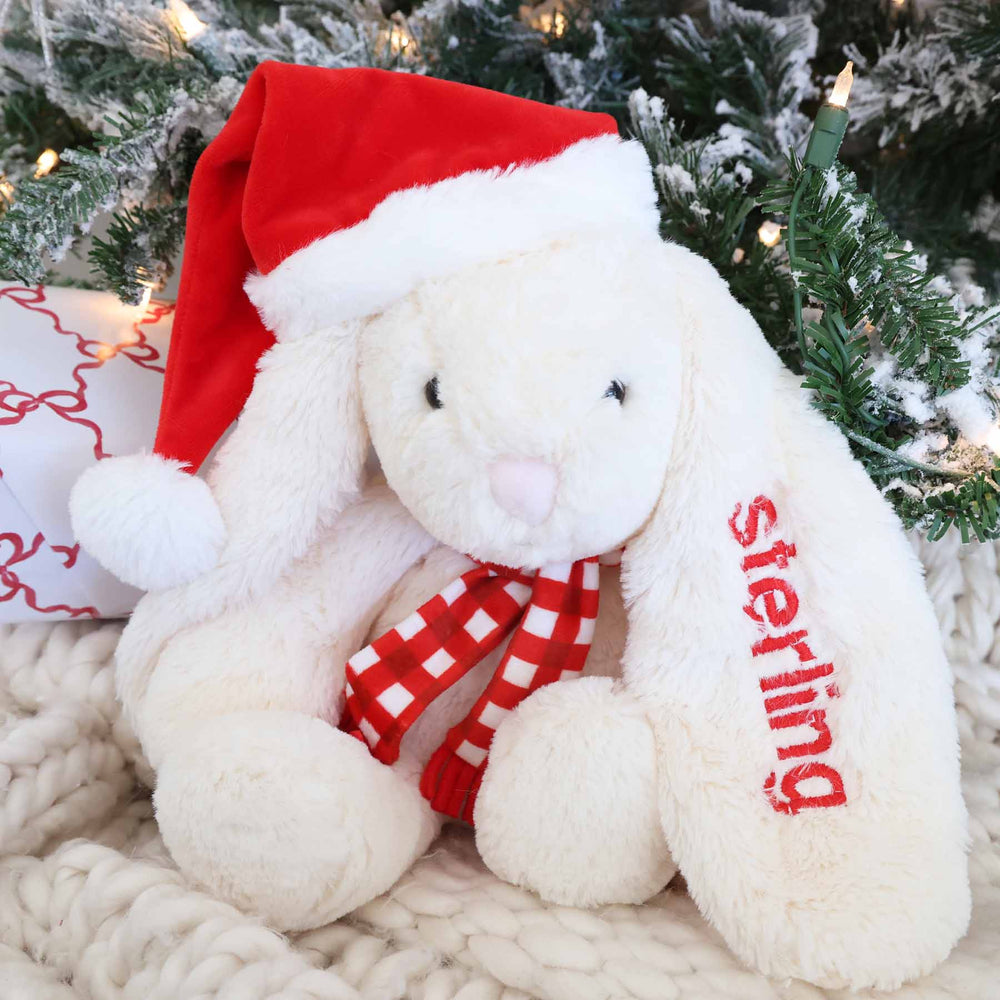 white christmas bunny stuffed animal with name embroidered on the ear in red font 