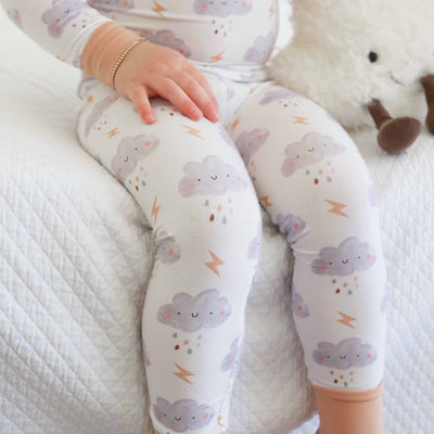 gender neutral pajamas for kids with smiley thunderstorm clouds 