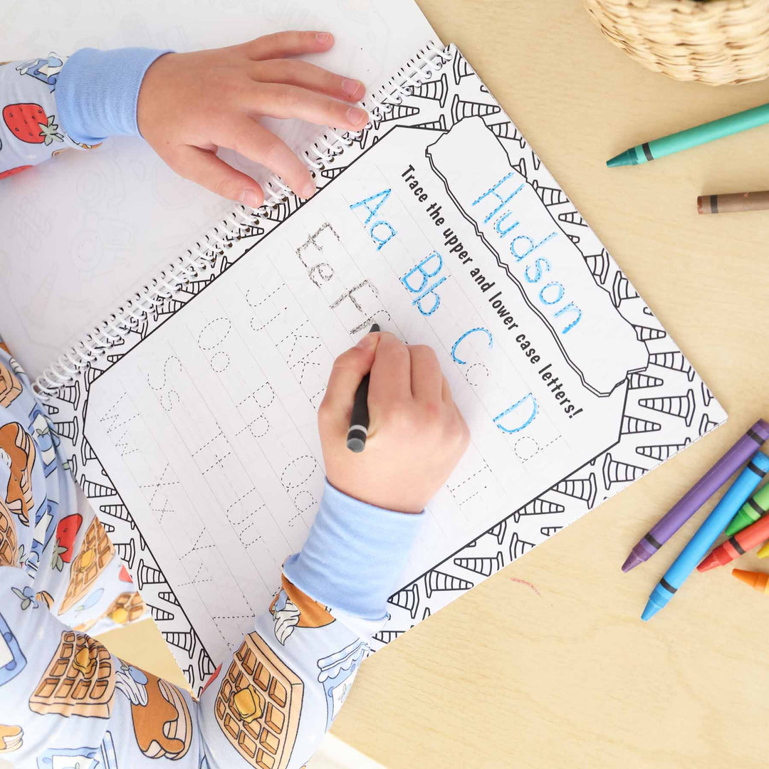 coloring book with traceable upper and lowercase letters personalized with child's name at the top 