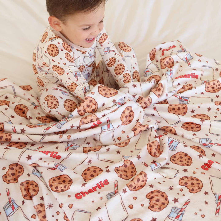 kids wearing milk and cookies two piece pajama set with matching personalized blanket