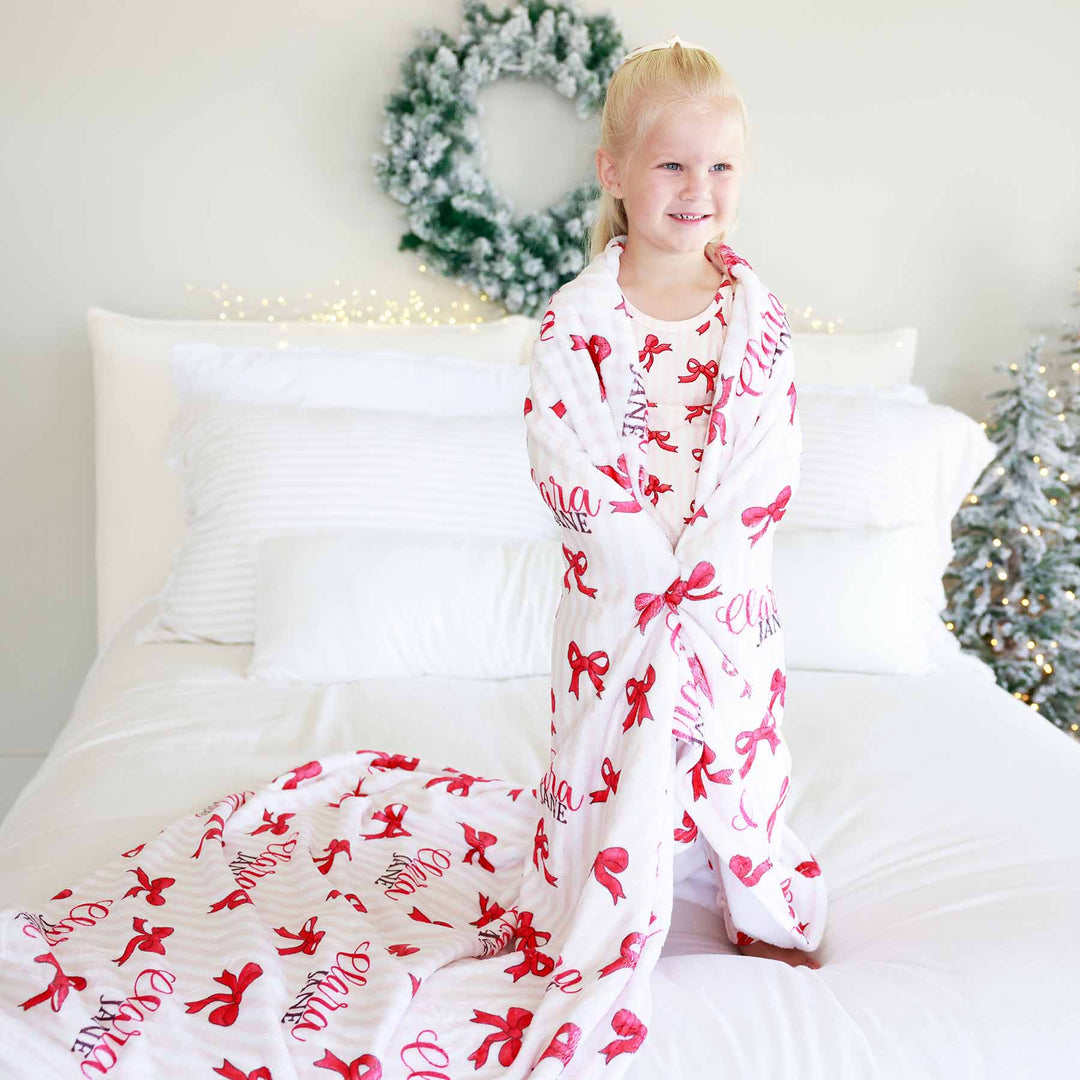 pink and white stripe with red bow and name girly christmas blanket for kids personalized