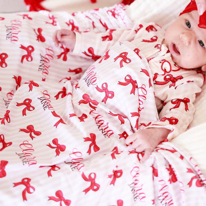 coquette christmas striped swaddle for girls with red bows 