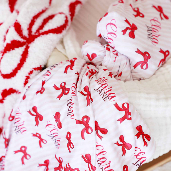 girly christmas bow personalized name swaddle for girls 
