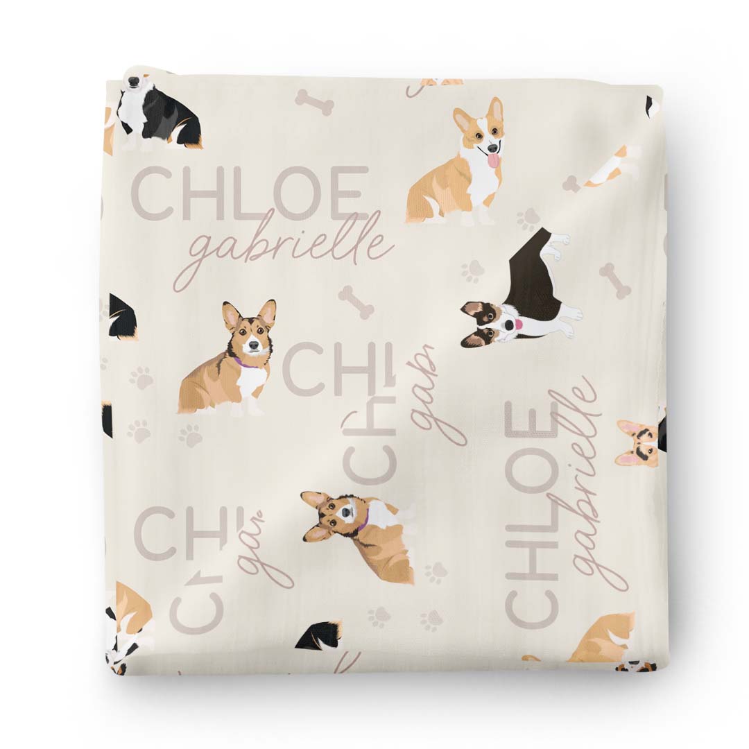 neutral swaddle blanket with corgis 