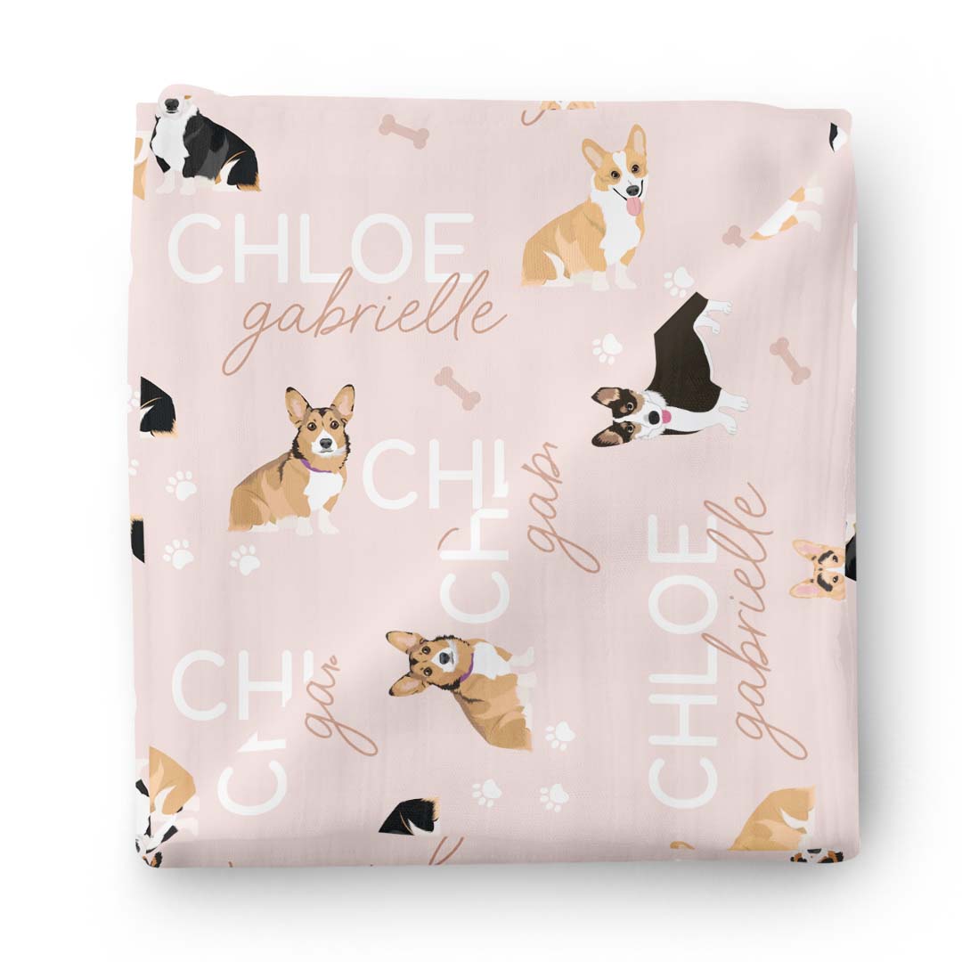 pink personalized swaddle blanket with corgis 