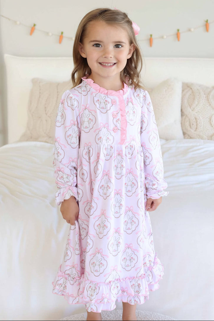 standing girl in frilly easter nightgown long sleeve with turned around bunnies and pink bows 