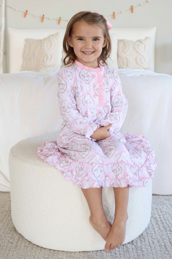 girl sitting on ottoman in long sleeve midi length ruffle nightgown for easter cottontail couture 