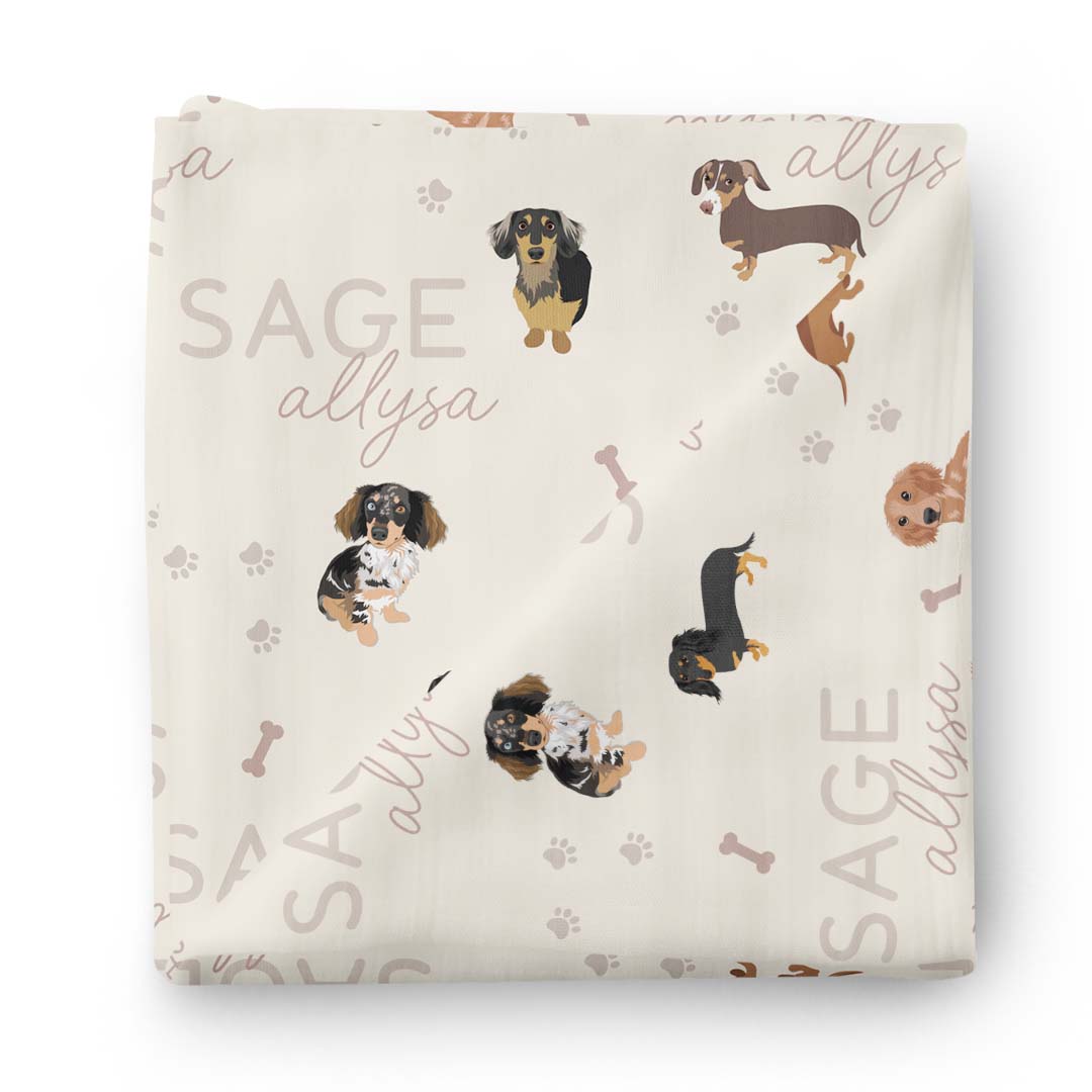 neutral personalized swaddle blanket for babies with wiener dogs