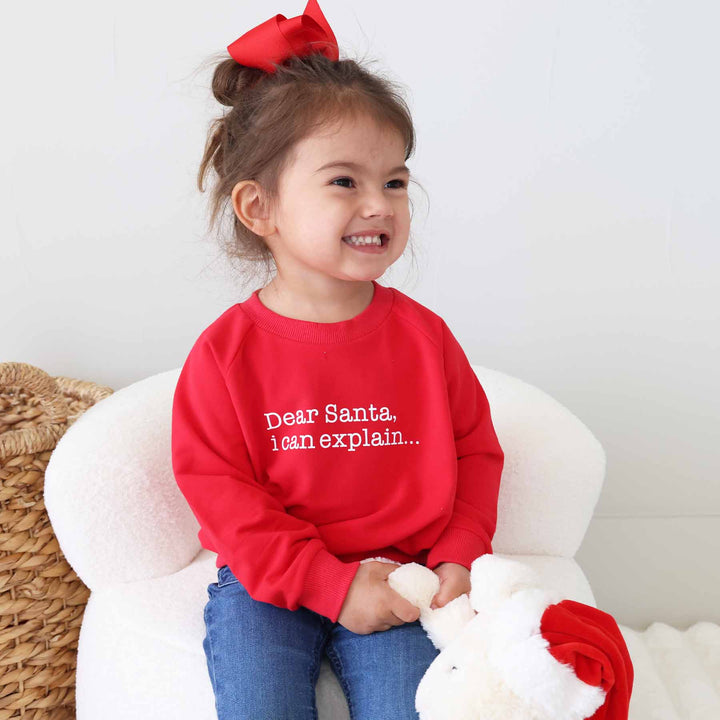 red long sleeve christmas sweatshirt for kids that says "dear santa i can explain..."