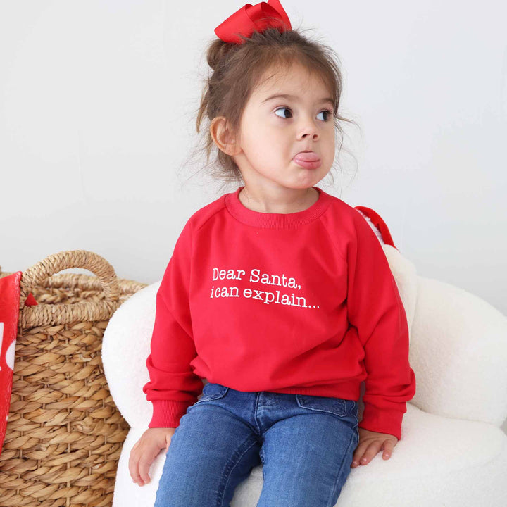 long sleeve christmas sweatshirt for kids that says "dear santa i can explain"