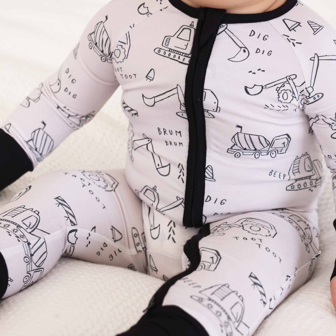 printed baby zip romper for boys with construction truck doodle print