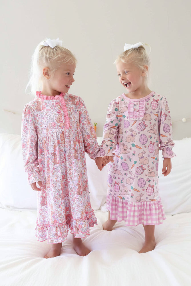two girls holding hands in long sleeve easter nightgowns 