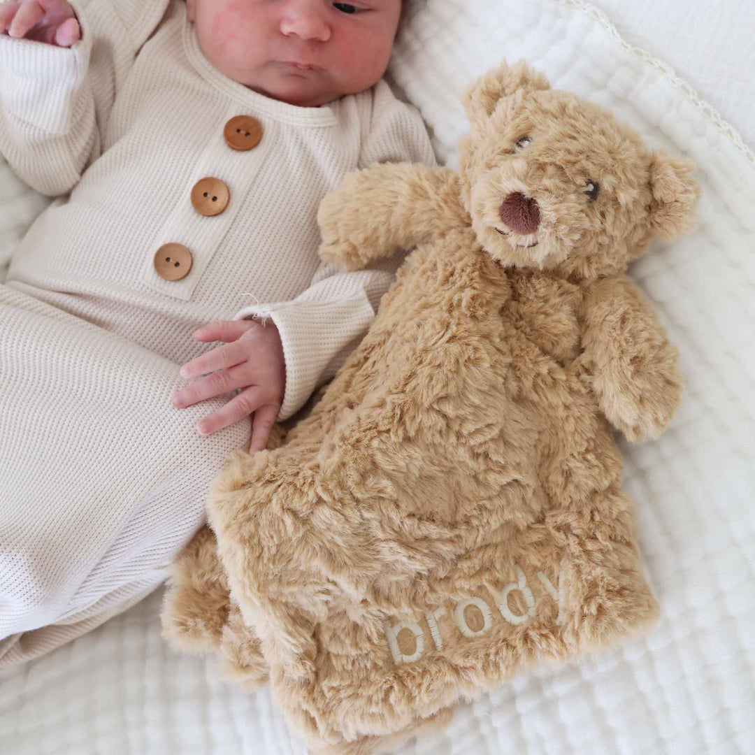 teddy bear embroidered name lovey for babies with white thread in block font 