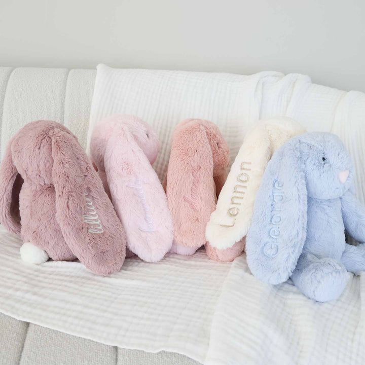 large cuddle plush bunnies with embroidered ear purple, pink, white and blue
