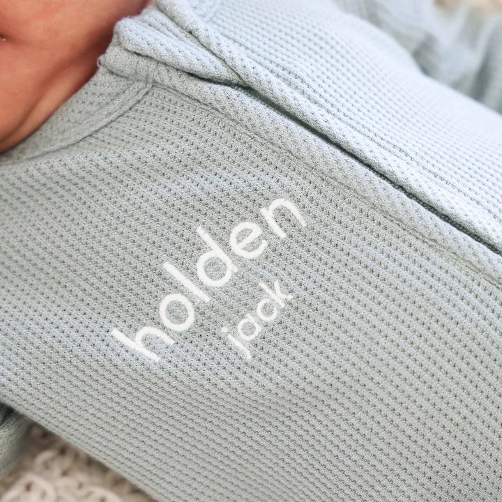 white thread embroidered green bamboo waffle zipper footie 