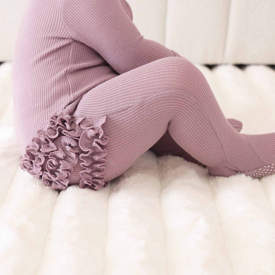 purple ruffle bottom embroidered zipper footie for girls 