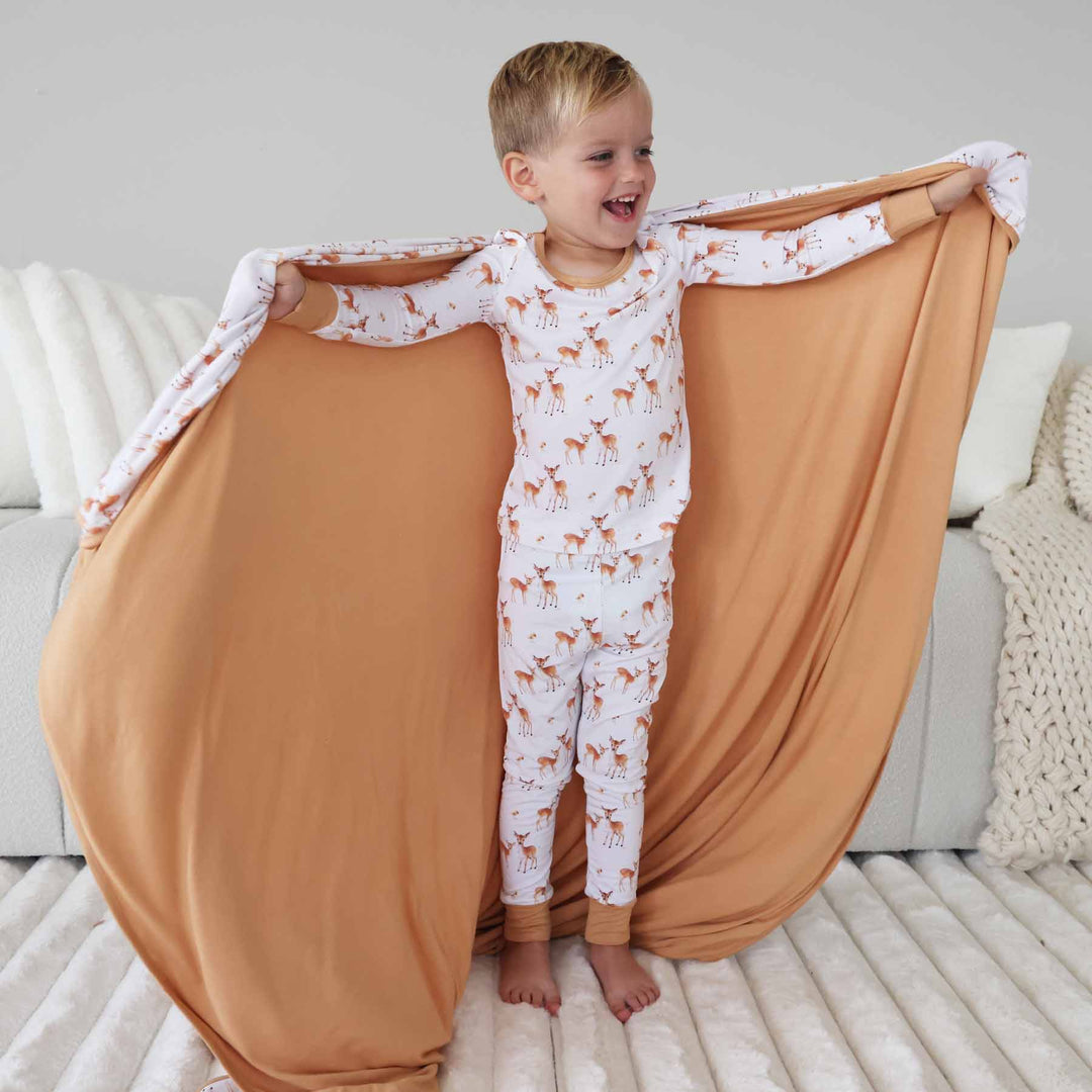 white bamboo blanket with brown fawn and mushrooms