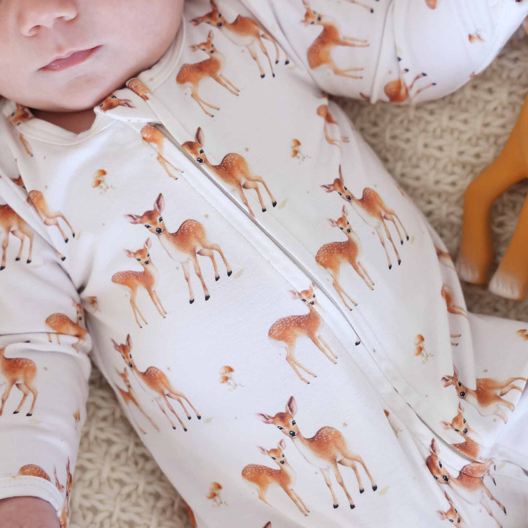 close up of deer and mushroom zipper footie pajama 