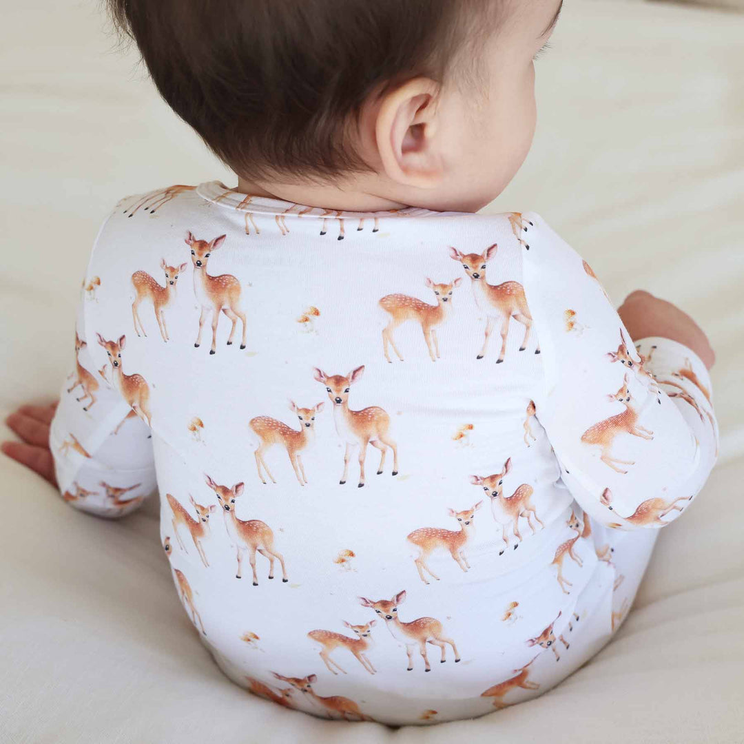 white baby zipper footie with fawn