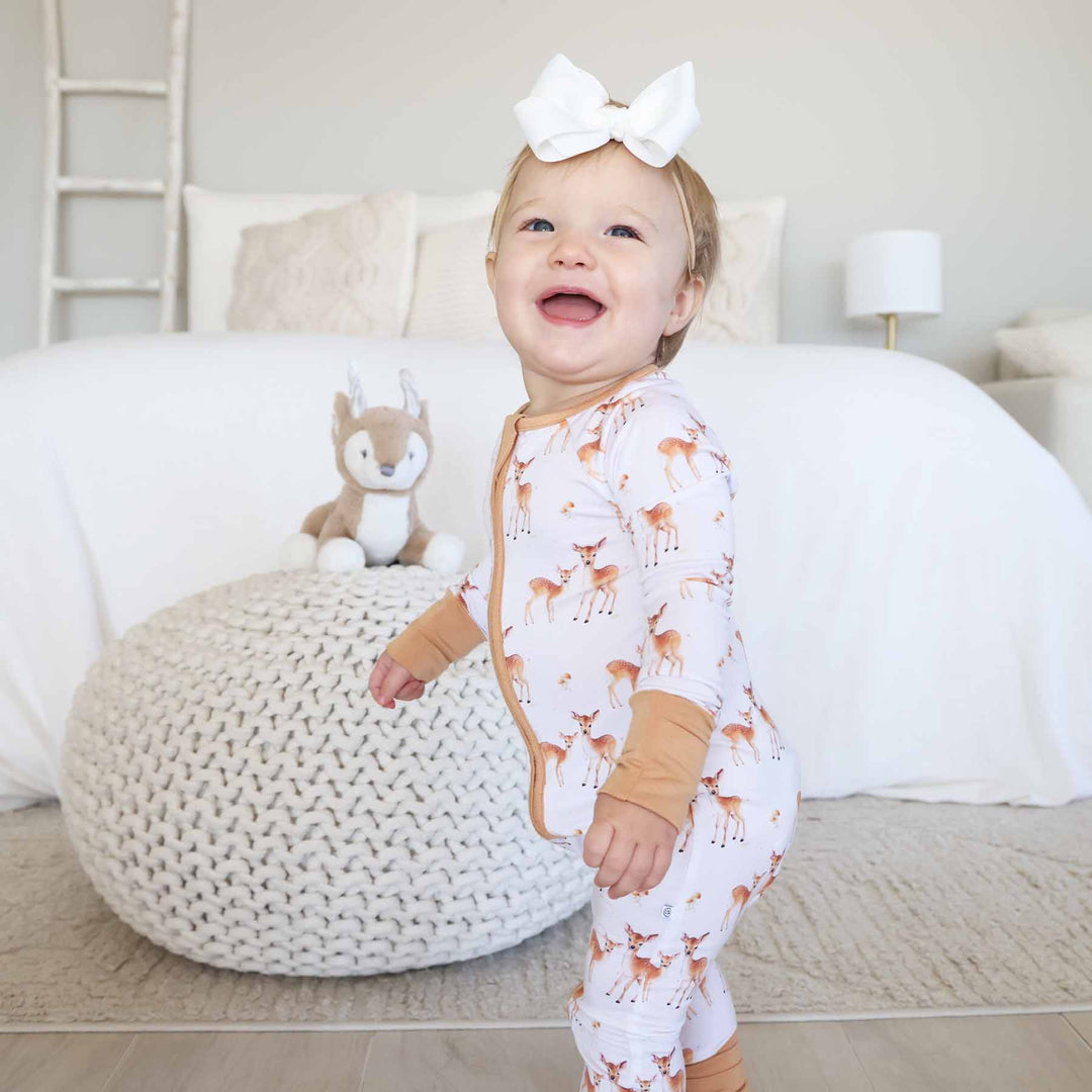 fawn and mushroom neutral zip romper pajama for baby and toddler girls 
