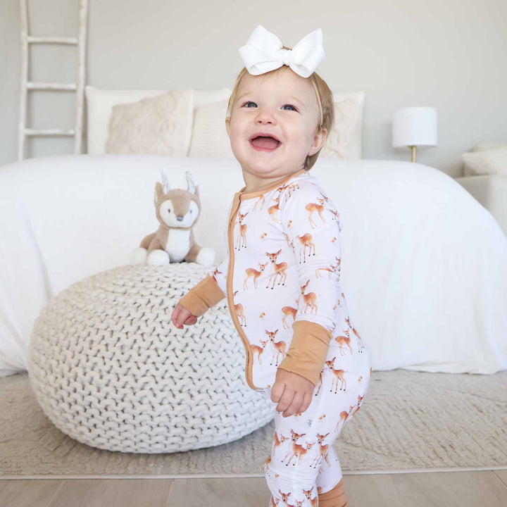 fawn and mushroom neutral zip romper pajama for baby and toddler girls 