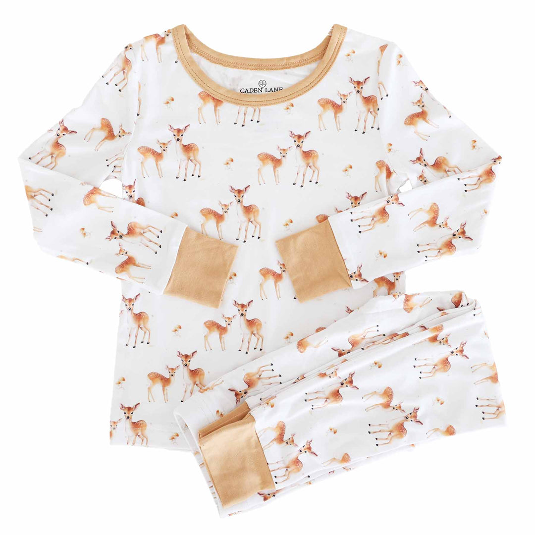 white long sleeve two piece pajama set for kids with deer, mushrooms and orange/brown trim