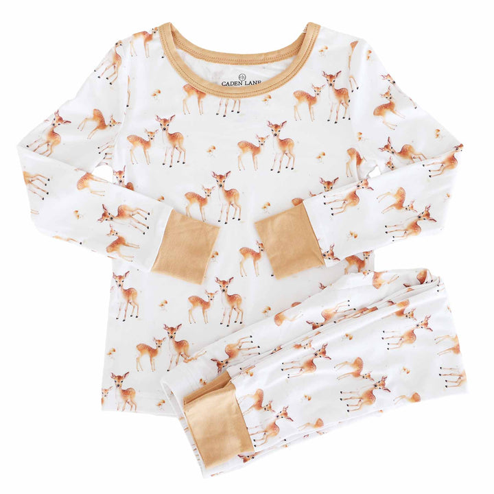 white long sleeve two piece pajama set for kids with deer, mushrooms and orange/brown trim