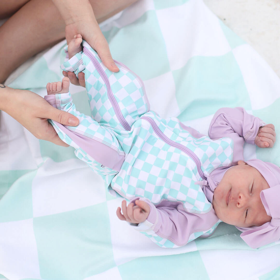 swim romper for babies full length purple and green checkered 