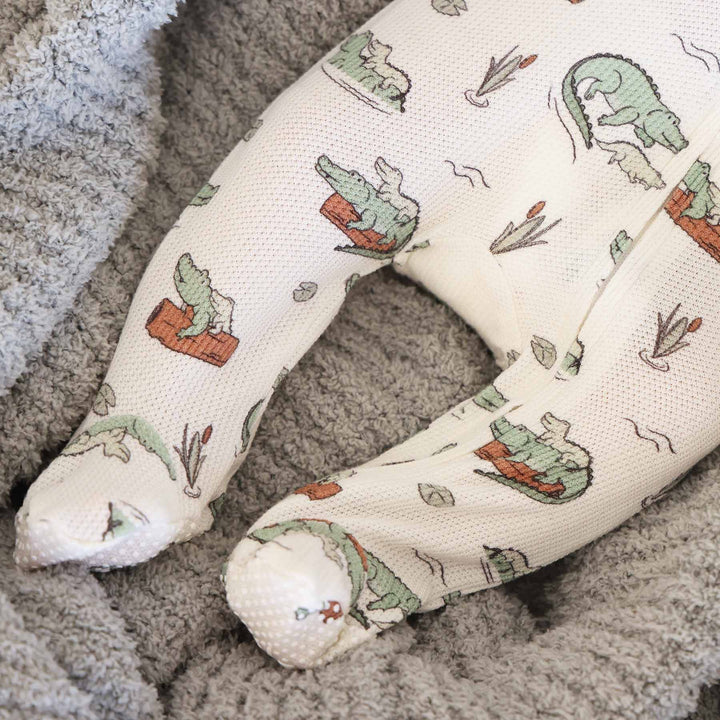 bamboo waffle baby zipper footie with alligators, logs and lily pads