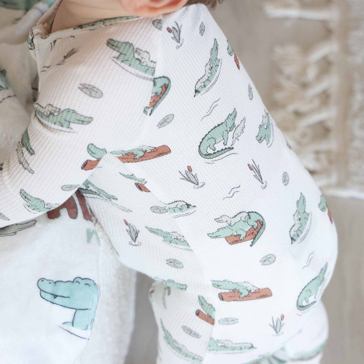 green, tan and brown alligator bamboo waffle convertible zip romper for babies and toddlers with flip mitts and footies 