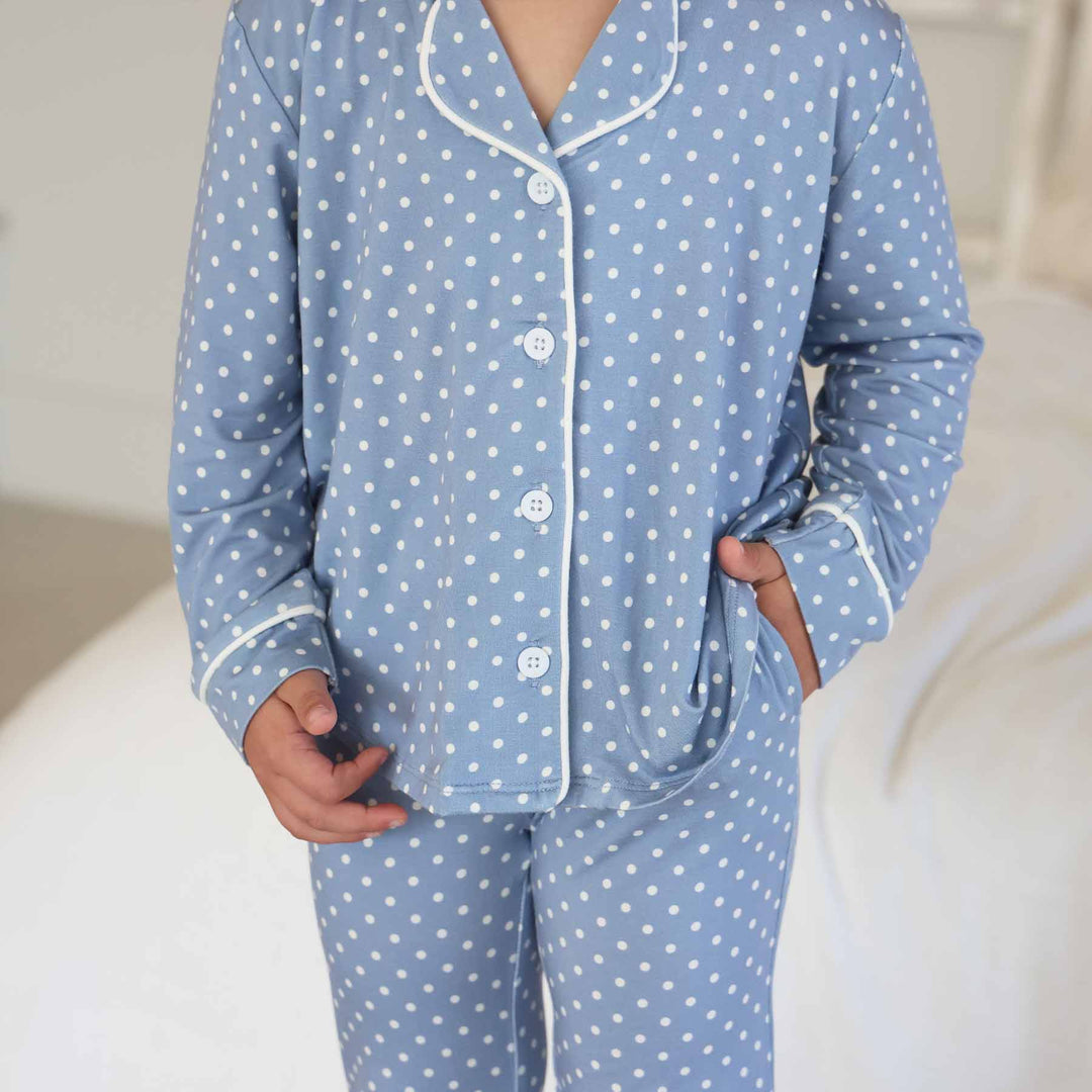 closeup shot of dusty blue girl's long sleeve lounge set with white polka dots made of bamboo viscose 
