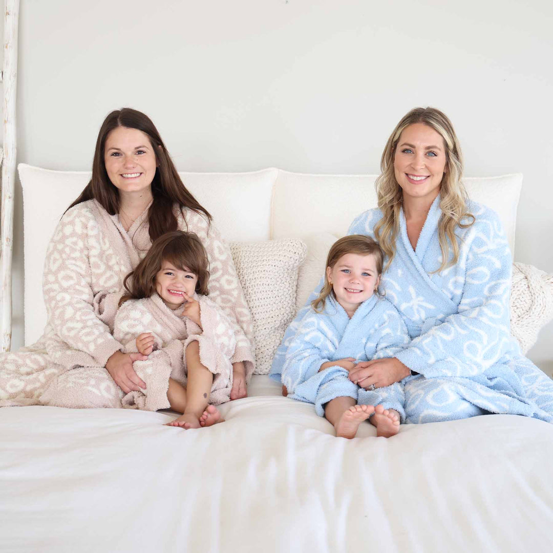 mom and daughter matching cuddlelane luxe robes in blue-tiful bows and leopard