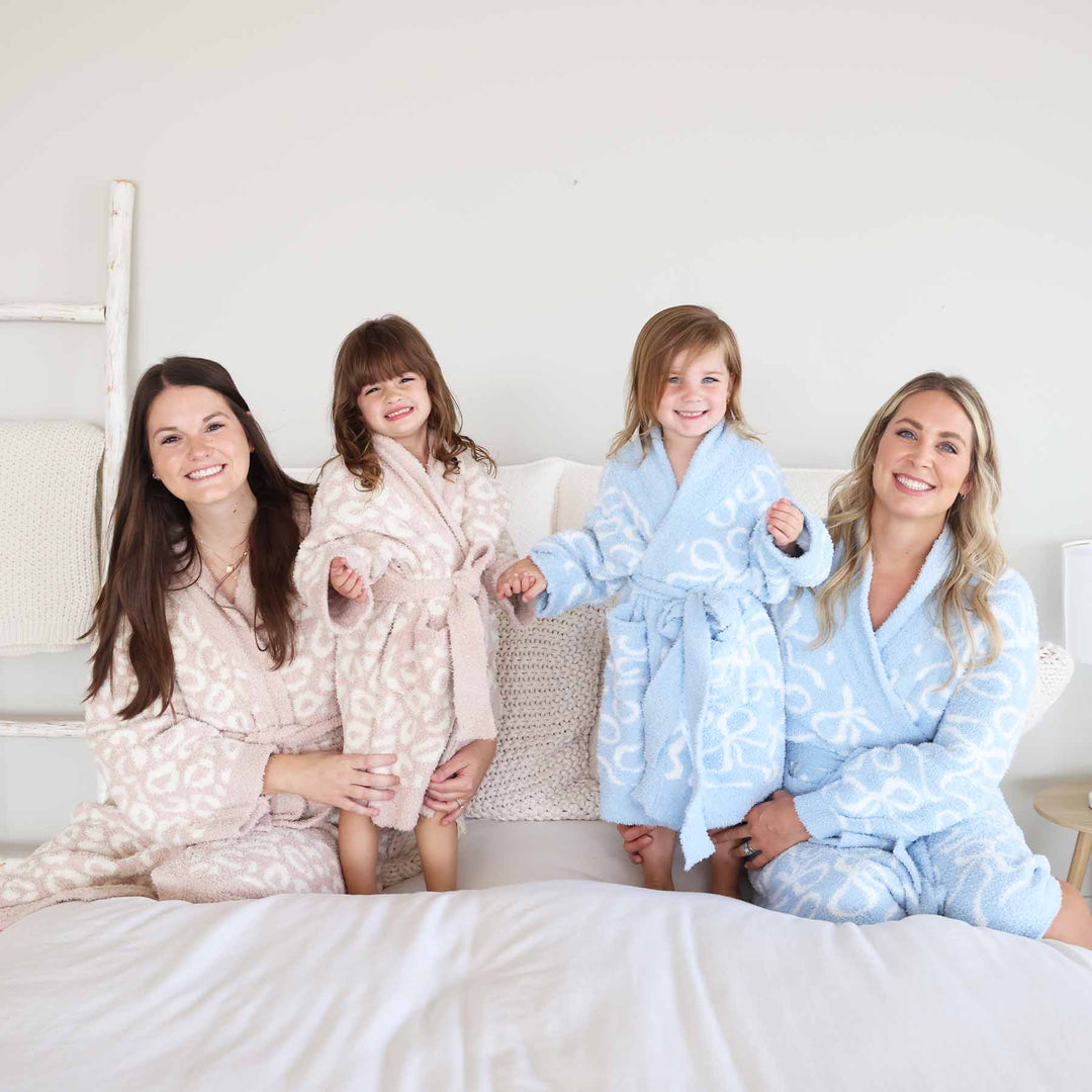cuddlelane luxe mommy and me matching robes in blue-tiful bows and leopard 
