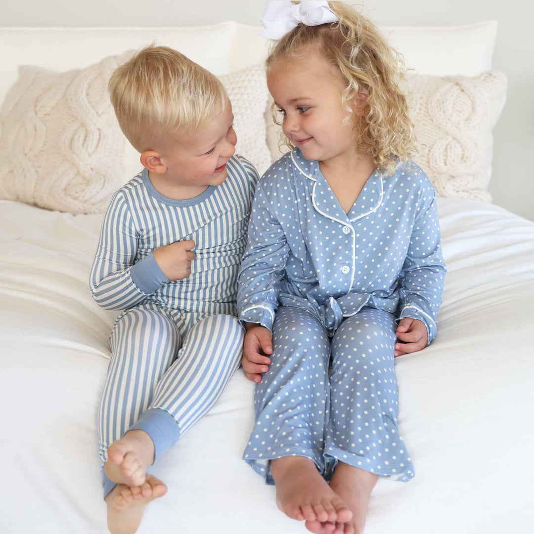 sibling matching pajamas for boy and girl. blue and white stripes and blue and white polka dots.