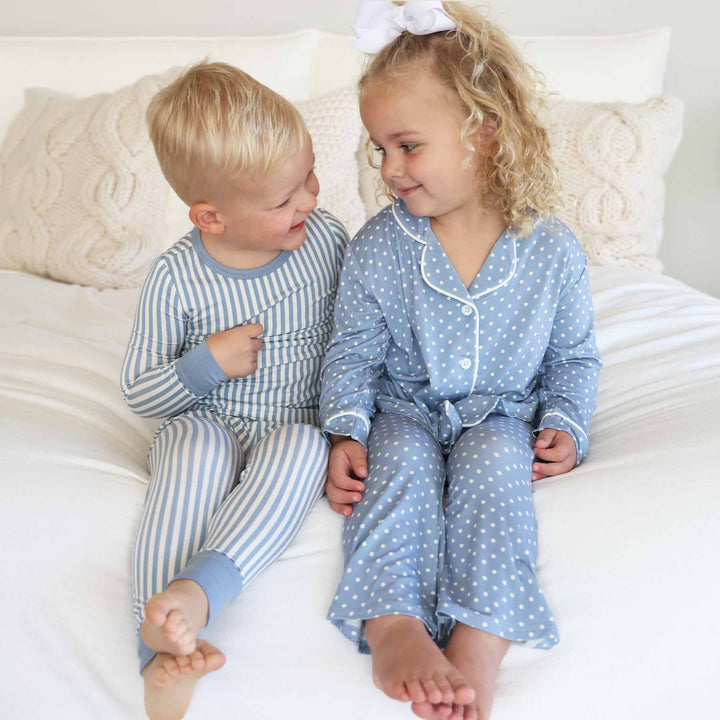 sibling matching pajamas for boy and girl. blue and white stripes and blue and white polka dots.