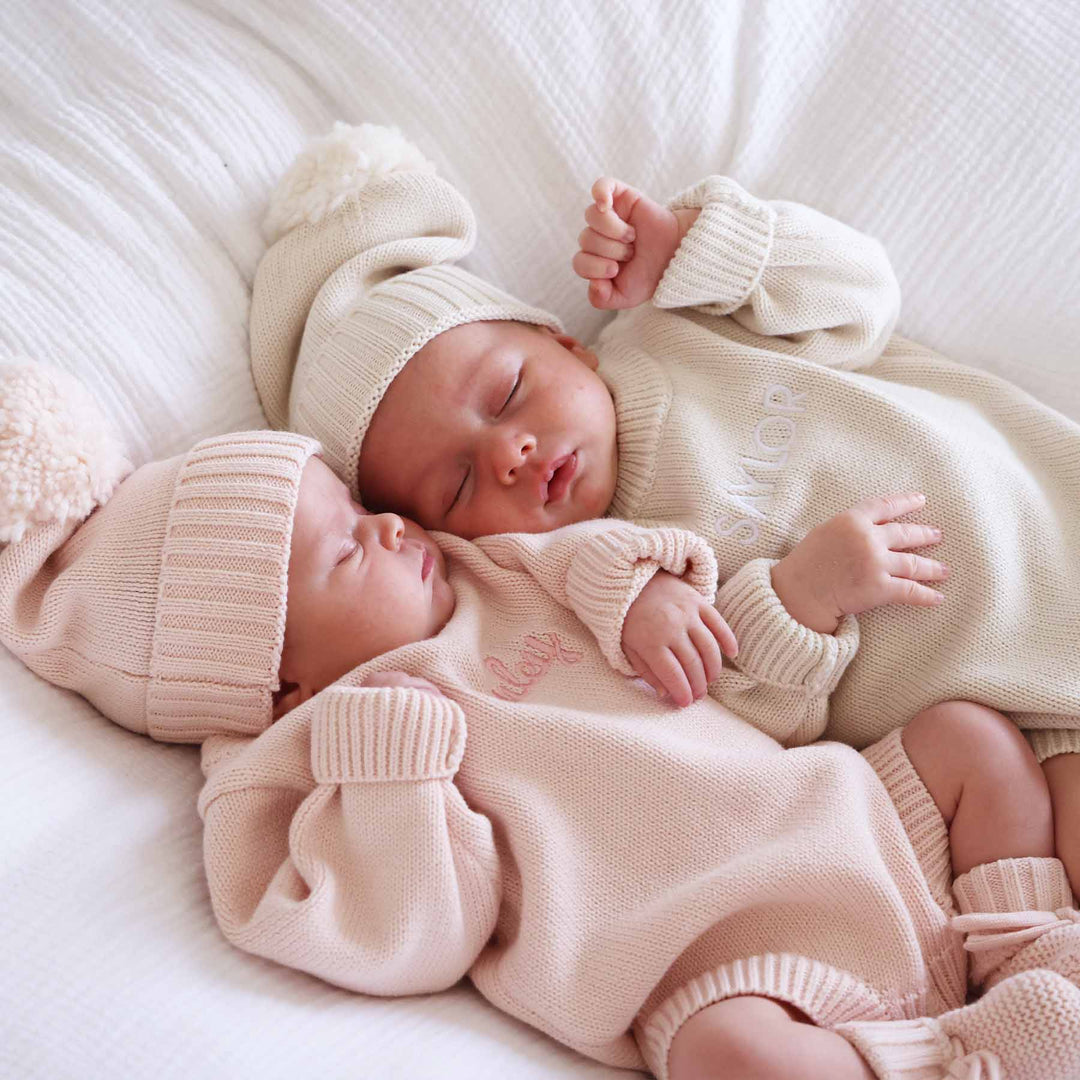 embroidered long sleeve sweater romper for babies with matching beanies and booties 