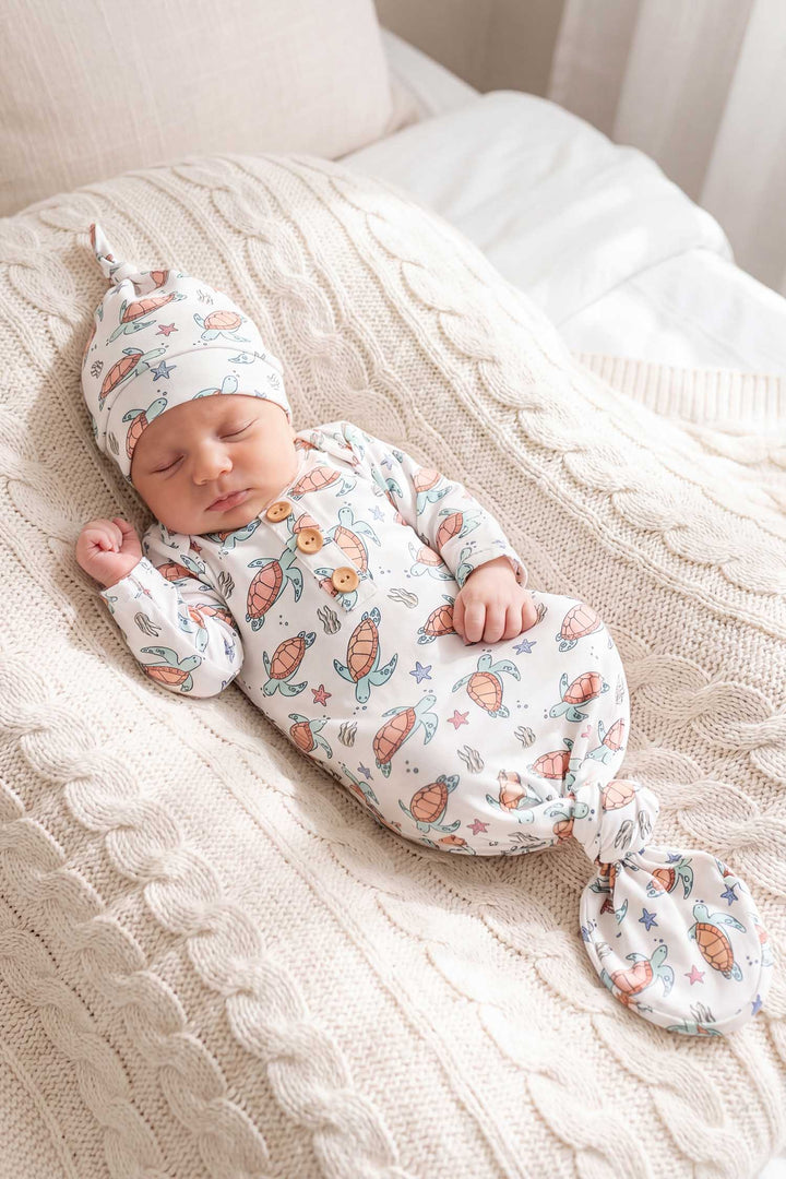 baby boy in turtle knot gown