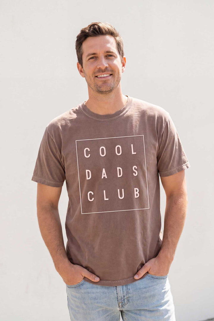 dad with hands in pockets wearing the cool dads club square graphic tee