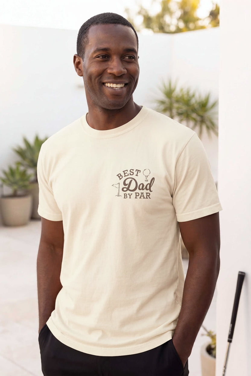 man standing with hands in pockets in best dad by par graphic tee