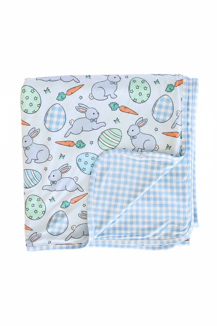 blue easter egg, bunny and carrot easter bamboo blanket with a blue and white gingham reverse side 