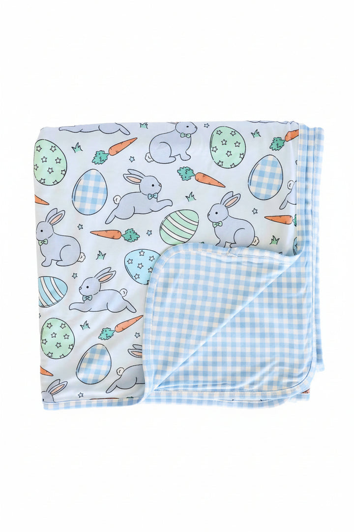 blue easter egg, bunny and carrot easter bamboo blanket with a blue and white gingham reverse side 