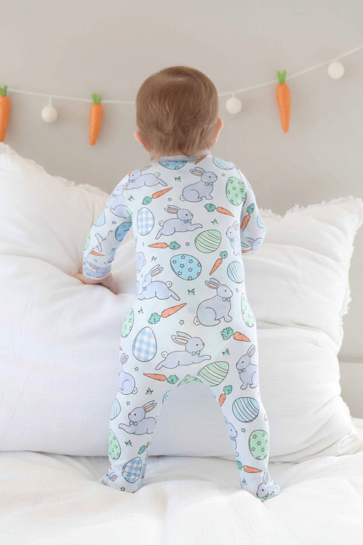 blue baby easter footie with printed easter eggs, bunnies with bowties and carrots 