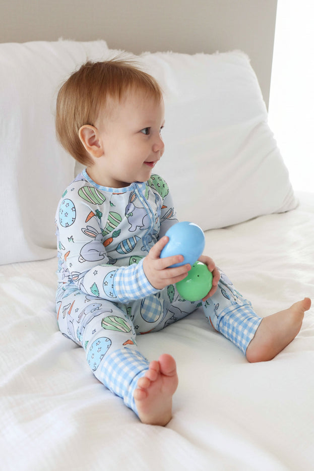 hoppy spring blue convertible zip romper pajama for boys with easter eggs, bunnies and carrots with gingham details