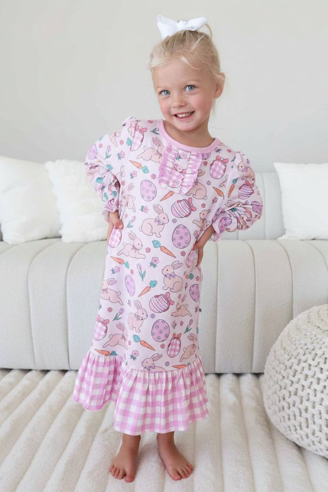 girl wearing a pink bunny, easter egg, carrot and flower long sleeve gingham nightgown