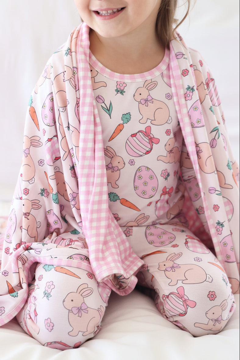pink easter two piece pajama set for girls with a matching double sided bamboo blanket 